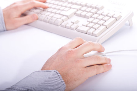 man working on office place with all white devices
