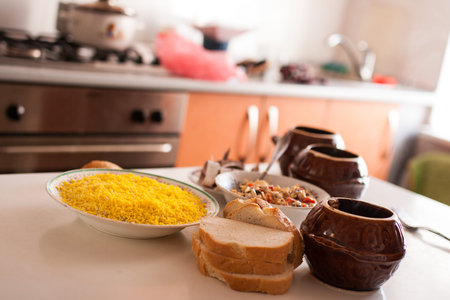 dinner meals prepared on a dining table on a kitchenの写真素材