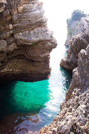 clear blue sea, deep place by the rocksの写真素材