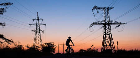 Silhouette of a biker on an eveningの写真素材