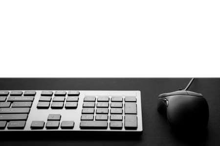 Black keyboard with mouse  in a front of monitor. Gaming mouse and keyboard with copy space.の写真素材