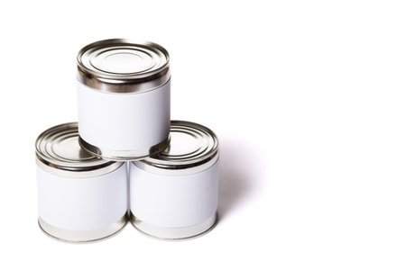 Three metal cans with no lable isolated on a white background.