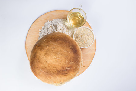 White bread with ingredients, view from top, on a white backgrond with copy space.