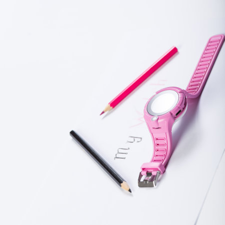 Pink watch for kids and on a white piece of paper written my watchwith black and pink pencils.の写真素材