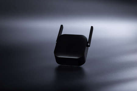 Black amplifier of wifi network on black background.の写真素材