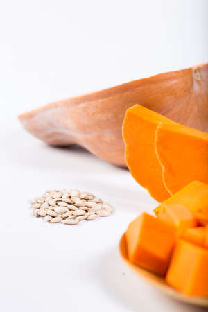 Seeds and pulp of pumpkin different size, close-up, on a white background.の写真素材