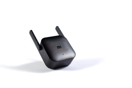 Editorial image of wifi amplifier Xiaomi Pro isolated on a white with copy space.