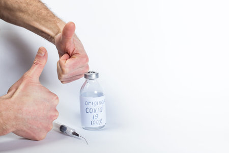 Distribution of fake  vaccine. Hands shows thump up for Fake vaccine, on a white background with...