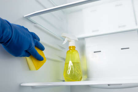 Move out bad odor from refrigerator with spray detergent and sponge.の写真素材