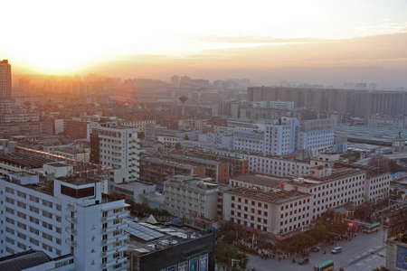 KUNMING - DECEMBER 6, 2010  Aerial view of the morning sunrise over the city on December 6, 2010 in Kunming, China  Kunming is the largest city in Yunnan Province of China のeditorial素材