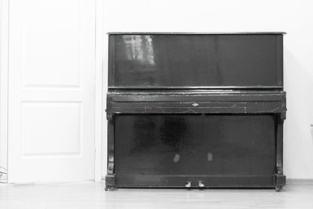 classic musical instrument black piano on white background .