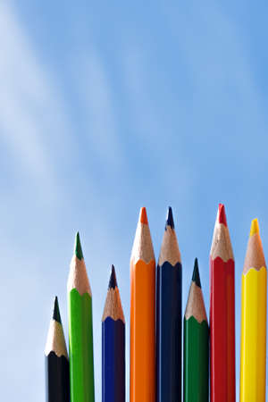Color pencils isolated on blue sky backgroundの写真素材