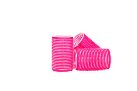 Pink hair curler isilated on white backgroundの写真素材