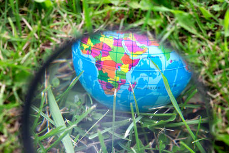Globe sphere orb model effigy on green grassの写真素材