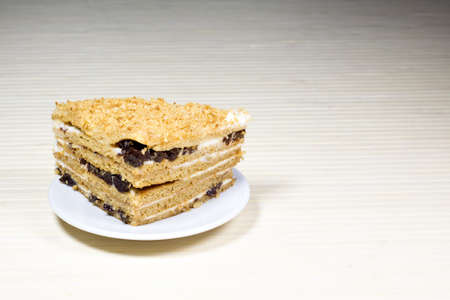 Creamy cake on plate on tableの写真素材