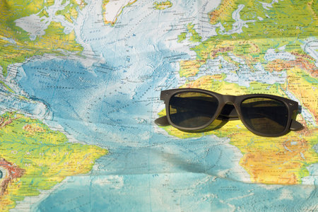 sun glasses and map