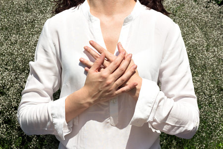 Woman praying hands together, namaste, yogaの写真素材