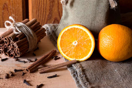 Fresh oranges with cinnamon sticksの写真素材