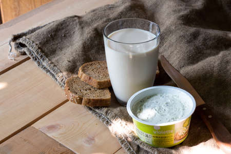 Natural local food products on wooden table - rustic composition captured from above. Country lifestyle, rural vacation or agritourism concept.の写真素材