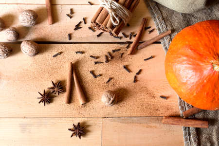 Pumpkin spice with cinnamon and nutmeg in still lifeの写真素材
