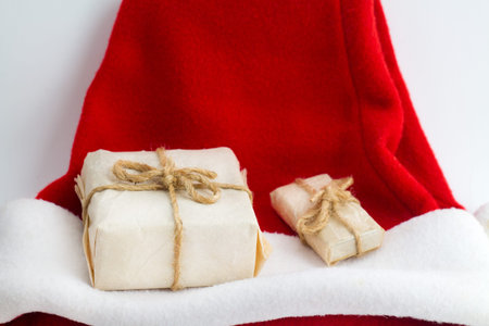 Christmas present on santa hat on white backgroundの写真素材