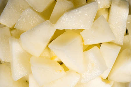 Cantaloupe melon pieces texture backgroundの写真素材