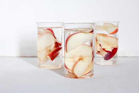Autumn themed detox water with apple. Scene on white wood backgroundの写真素材