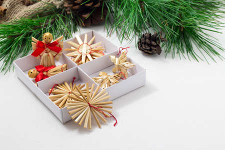 Happy New Year greeting card. Frame, border. Green Christmas tree, toys, pine cones on a white background.の写真素材