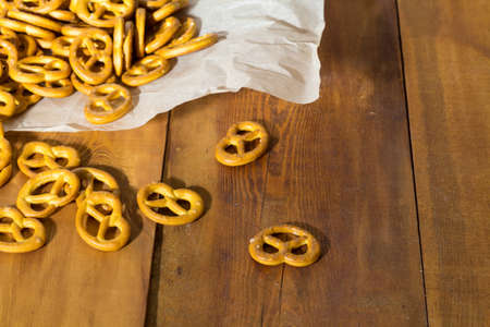Homemade pastries. Pretzel on wooden background. Foodの写真素材