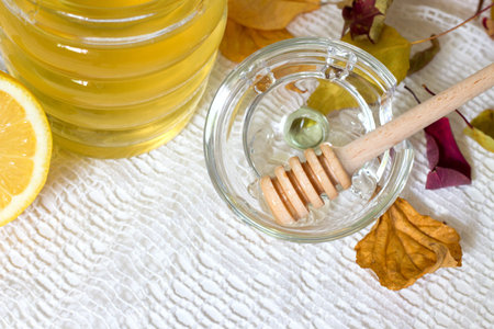 Fresh organic honey on white tableclothの写真素材