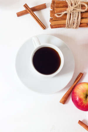 Coffee cup on white wooden table top view on old woodenの写真素材