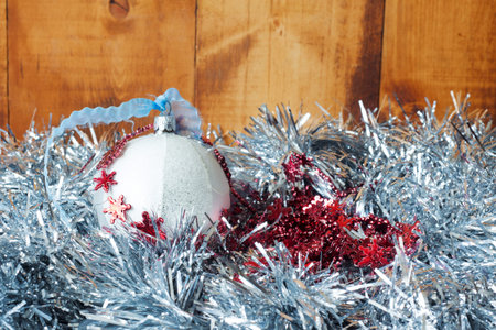 Silver decorative snowflakes on silver glitter christmas backgroundの写真素材