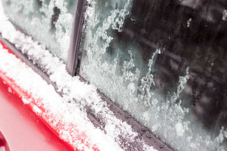 Car on the street covered by icy rain.の写真素材