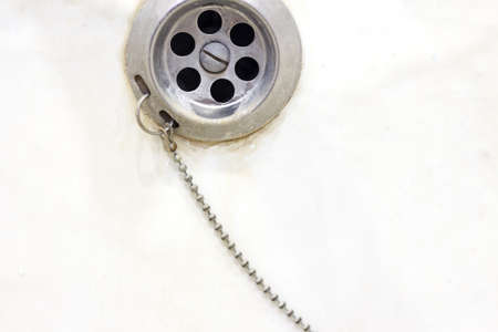 View of the sink, drain and flowing water for backgroundの写真素材