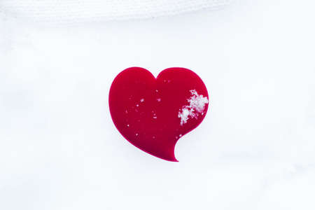 Alone red heart in white snow background. Love conceptの写真素材