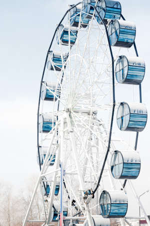 Ferris wheel against blue sky.の写真素材