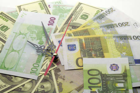 Euro money and watch hands . Time money or business or bank or wealth or rich conceptの写真素材