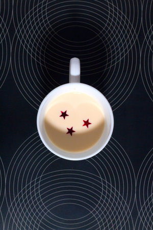 glass with milk with stars and moon shadow . the sky in a glass concept