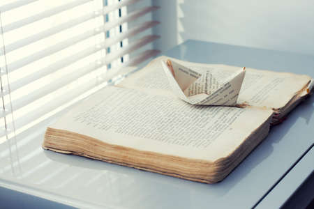 a paper ship is on the road book . way to fantasy of dreams conceptの写真素材