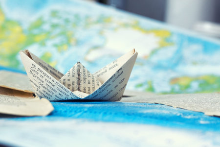 a paper ship goes on a journey . travel of a paper ship