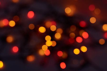 abstract blurred and silver glittering shine bulbs lights background: blur of Christmas wallpaper...