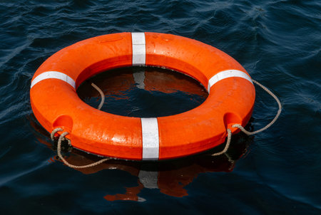 Lifebuoy in the blue water of the lake