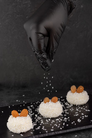 delicious dessert creamy souffle decorated with coconut chips and nutsの写真素材