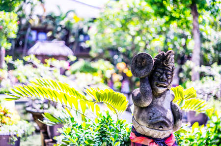 Stone statue of a Hindu god in a Gardenの写真素材