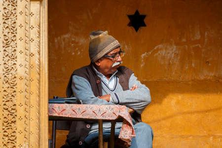 Jaisalmer India, January 4, 2020: An elderly male inspector at the entrance to the museum on the territory of the fort.のeditorial素材