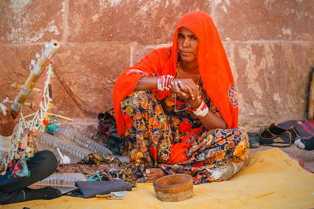 Jodhpur Rajasthan India - January 2020: Woman in red sari begs for alms near Jodhpur fortのeditorial素材