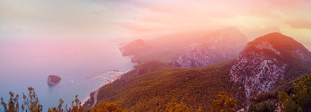 Antalya, Turkey. Sunset against the backdrop of mountains overlooking the sea coast.の写真素材