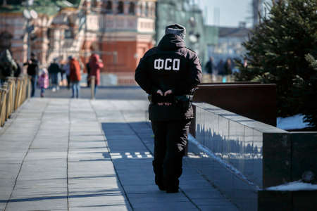 Russia, Moscow, March 2021: An employee of the Federal Security Service is on duty in Red Square, near the Lenin Mausoleum.のeditorial素材