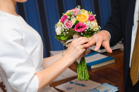 Newlyweds exchange ringsの写真素材