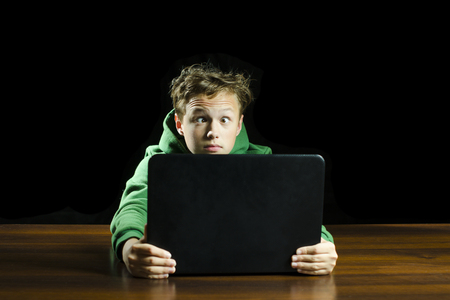 Young boy using a laptop computerの写真素材